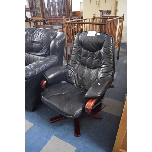 409 - A Modern Black Leather Swivel Reclining Armchair