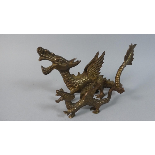 17 - A Pair of Bronzed Winged Dragon Ornaments, 23cm x 14cm Long