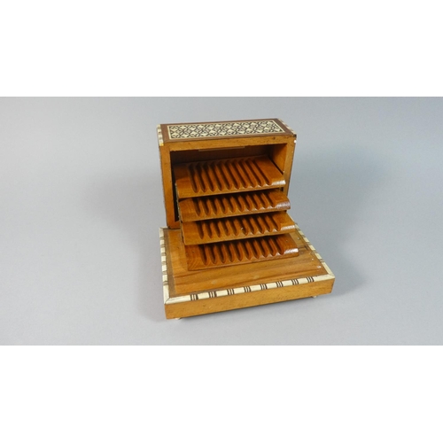 34 - An Indian Inlaid Musical Cigarette Box with Cantilevered Interior, 17cm Wide