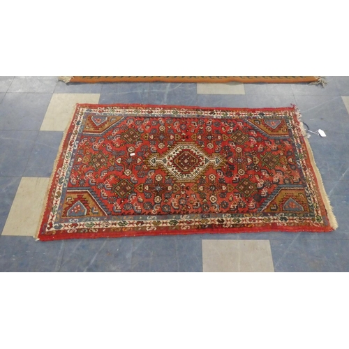 459 - A Patterned Handmade Woollen Rug, 132cm Wide