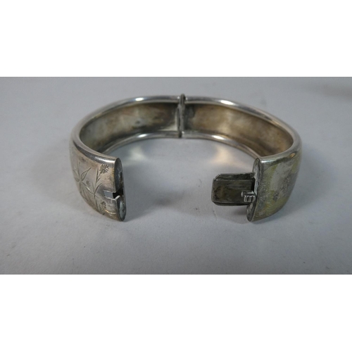 463 - A Victorian White Metal Bangle with Engraved Decoration