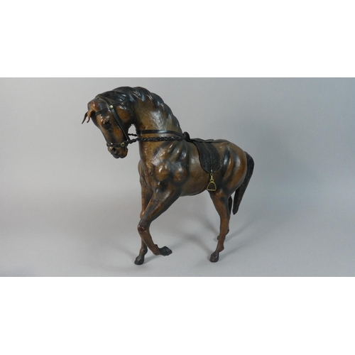 61 - A Mid 20th Century Leather Covered Study of a Spanish Horse, 32cm High