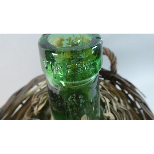 70 - A Wicker Covered Green Glass Bottle, 38cm High