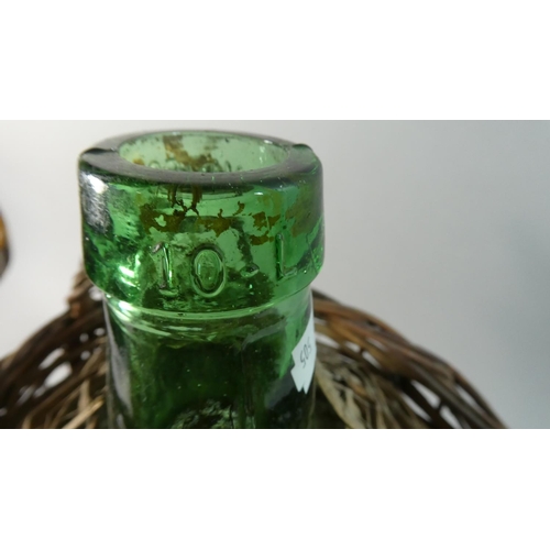 70 - A Wicker Covered Green Glass Bottle, 38cm High