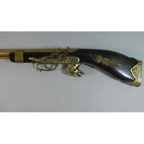 84 - A Brass Mounted Wall Hanging Model of a Flintlock Rifle, 105cm Long