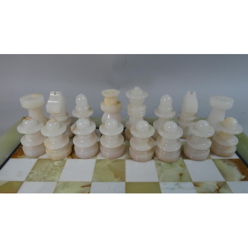 87 - A Mid/Late 20th Century Onyx Chess Board and Complete Set of Chess Pieces, 41cm Square