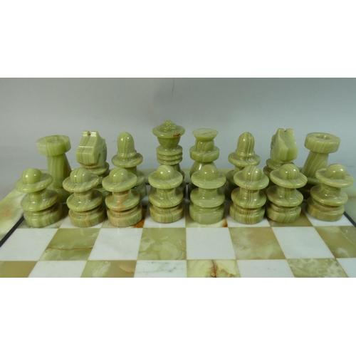 87 - A Mid/Late 20th Century Onyx Chess Board and Complete Set of Chess Pieces, 41cm Square