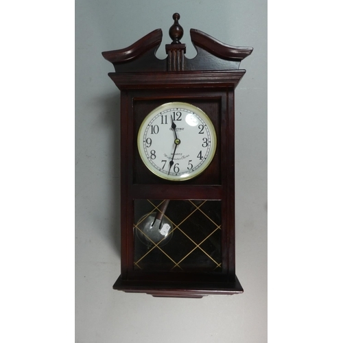 44 - A Reproduction Mahogany Cased Wall Clock with Westminster Chime Quartz Movement, 57cm High