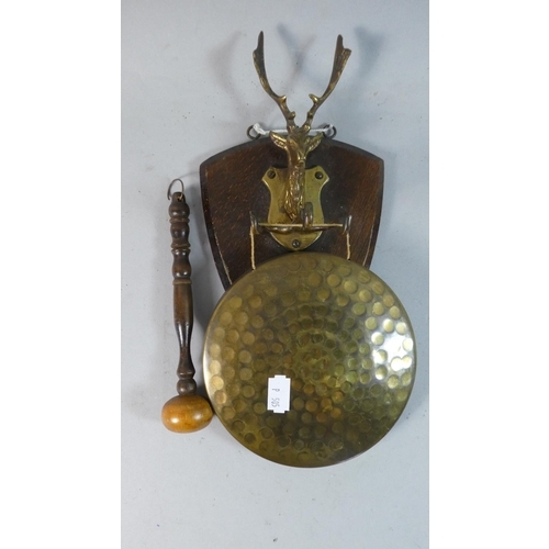 82 - An Edwardian Wall Hanging Brass Gong with Stag's Head Mount to Shield, Total Height 33cm