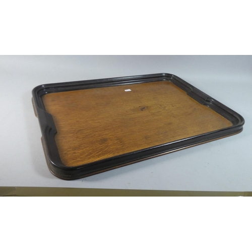 100 - An Edwardian Oak Two Handled Tray, 57cm Wide