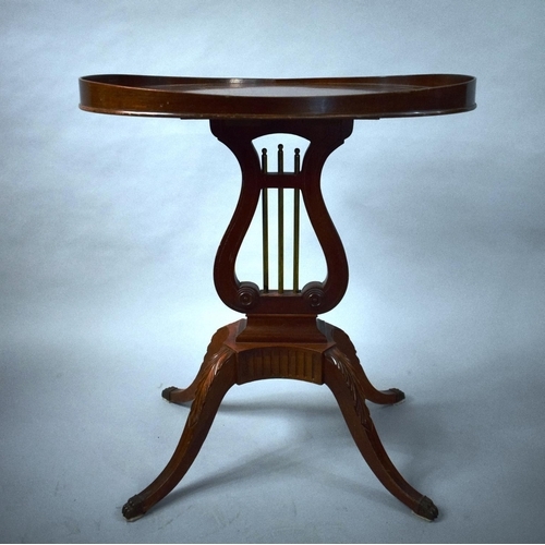 65 - A Reproduction Mahogany Galleried Occasional Table with Lyre Support having Brass Rods. Four Scrolle... 