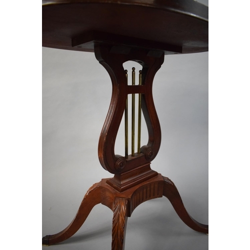 65 - A Reproduction Mahogany Galleried Occasional Table with Lyre Support having Brass Rods. Four Scrolle... 