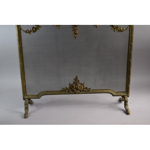 108 - A French Brass and wire Fire Screen Decorated with Foliate Swags and Ribbons on Scrolled Feet, 63cm ... 