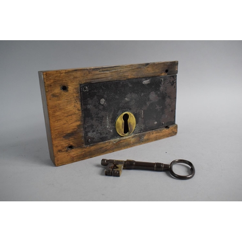 95 - A Georgian Brass Mounted Iron Door Lock in Wooden Surround with Key and Working, 25cm Wide