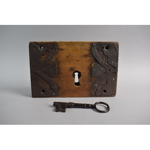 94 - A Georgian Iron Mounted Wooden Door Lock and Key. Working, 25cm Wide