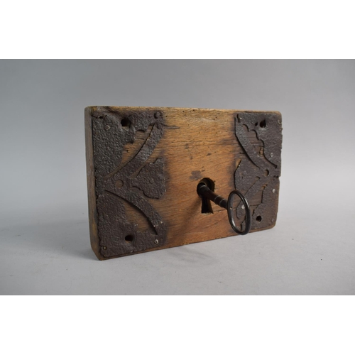 94 - A Georgian Iron Mounted Wooden Door Lock and Key. Working, 25cm Wide