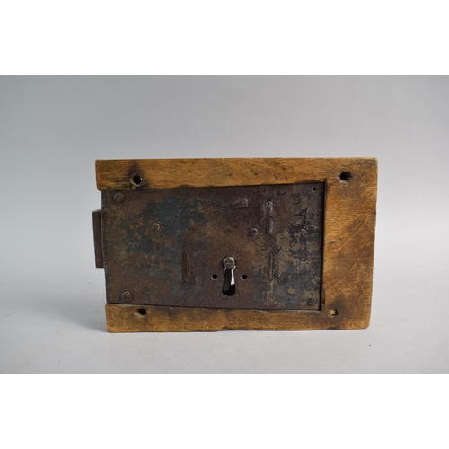 94 - A Georgian Iron Mounted Wooden Door Lock and Key. Working, 25cm Wide