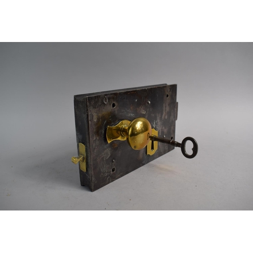 93 - A 19th Century Brass Mounted Iron Door Lock with Key. Sliding Mechanism, Working Order. Case 23cm Wi... 