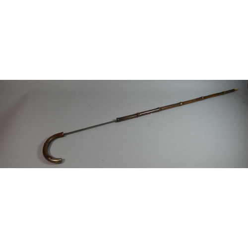 47 - A Silver Mounted Swordstick. 83cms Long