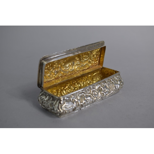 155 - A Small Rectangular Silver Dressing Table Box with Repousse Decoration, 9cms Wide, 50gms