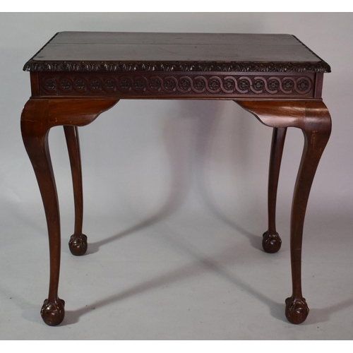 34 - A Mahogany Silver Table with Carved Border set on Cabriole Legs culminating in Claw and Ball Feet/ 8... 