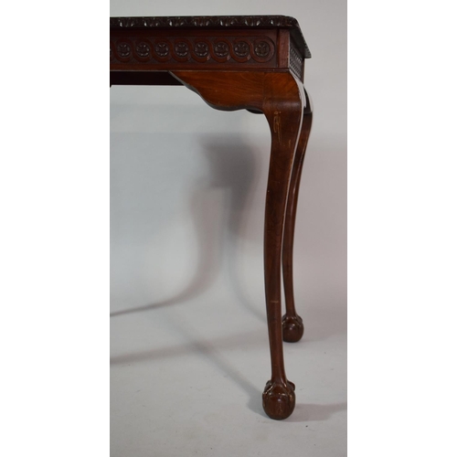 34 - A Mahogany Silver Table with Carved Border set on Cabriole Legs culminating in Claw and Ball Feet/ 8... 