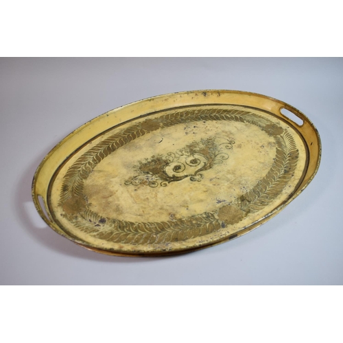 104 - An Early 19th Century Regency Toleware Oval Tray decorated with a Gilt Laurel Garland on a Cream Gro... 