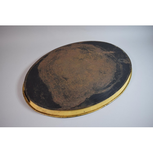 104 - An Early 19th Century Regency Toleware Oval Tray decorated with a Gilt Laurel Garland on a Cream Gro... 