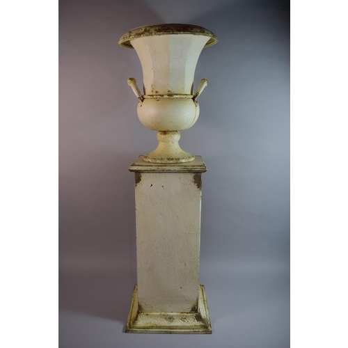 105 - A Painted Metal Classical Twin Handled Urn on Plinth. 95cms High