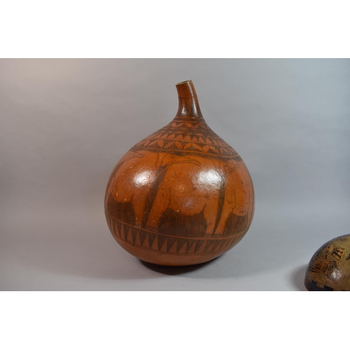 69 - A Collection of Three South American Carved Gourds, The Largest 38cm high