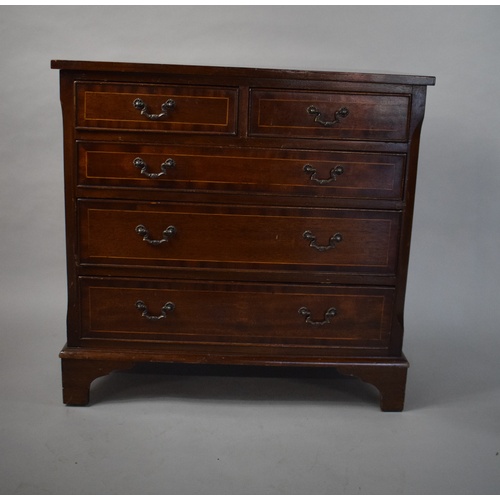 3 - A Small Reproduction Crossbanded Mahogany Chest of Two Short and Three Long Drawers on Bracket Feet.... 