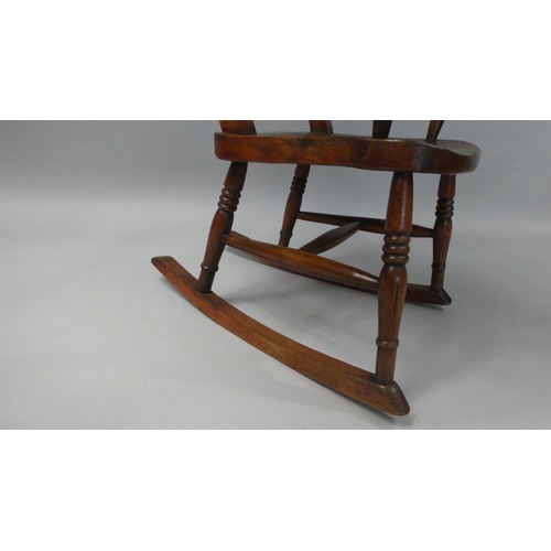 68 - A 19th Century Child's Rocking Chair Made from Beechwood with an Elm Seat, 68cm high