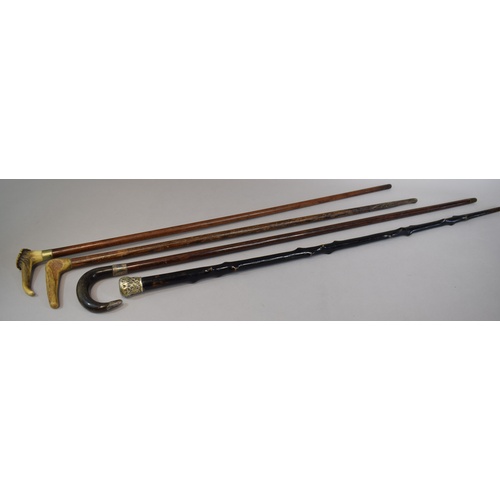 79 - A Collection of Two Horn Handled and One Bone Handled Walking Sticks Together with a White Metal Mou... 