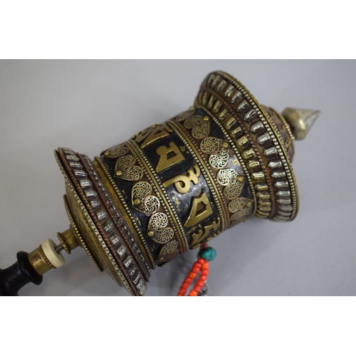 83 - A Tibetan Prayer Wheel with Turned Ebonised Handle, 37cm Long