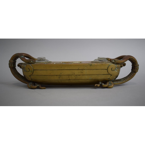 130 - A 19th Century Gilt Bronze Boat Shaped Desk Top Ink Stand with Double Snake Carrying Handles, Two Gl... 