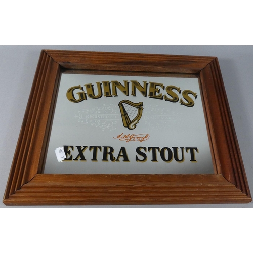 100 - A Reproduction Pine Framed Guinness Advertising Mirror, 37.5cm Wide