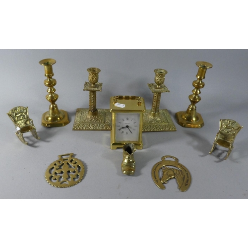 118 - A Collection of Brass Ornaments, Two Pairs of Brass Candlesticks and a Brass Carriage Clock (Overwou... 