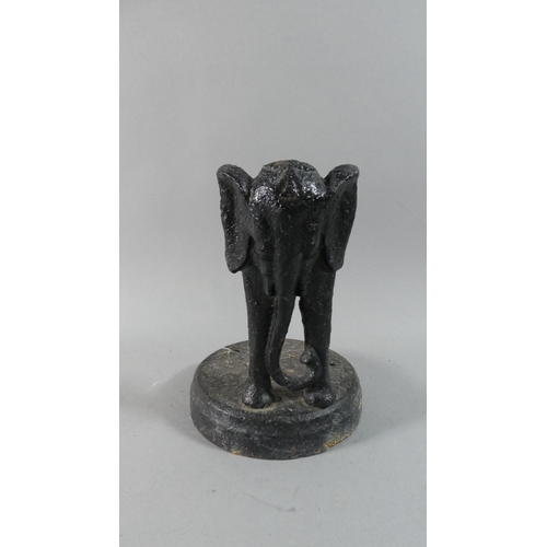 119 - A Late 19th Century Cast Iron Stand Decorated with Elephant, Part Missing, 22cm High