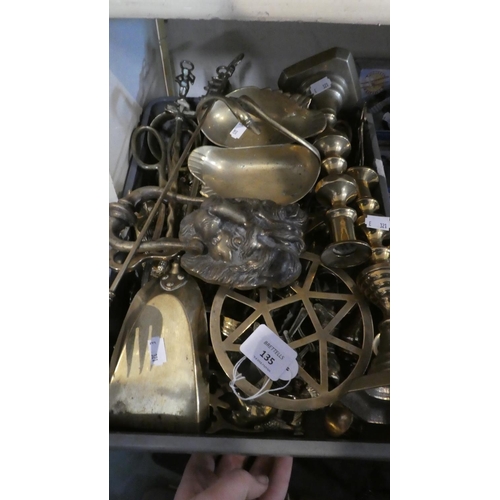 135 - A Box Containing Brass Ornaments, Candle Sticks, Lion Mask Door Knocker, Kettle Stands, Fire Irons e... 