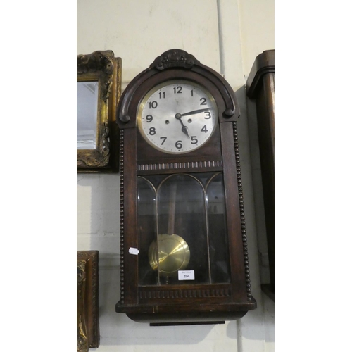 204 - An Edwardian Mahogany Cased Wall Clock with 8 Day Movement, 31cm WIde