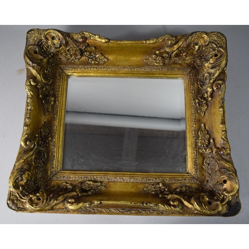 208 - A Reproduction Heavily Moulded Gilt Framed Bevel Edged Rectangular Wall Mirror, Some Loss