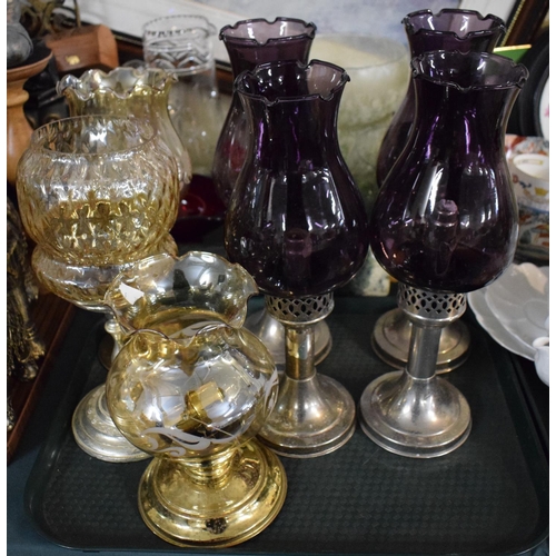 219 - A Tray of Candlesticks to Include Four Silver Plated Examples with Aubergine Glass Shades etc