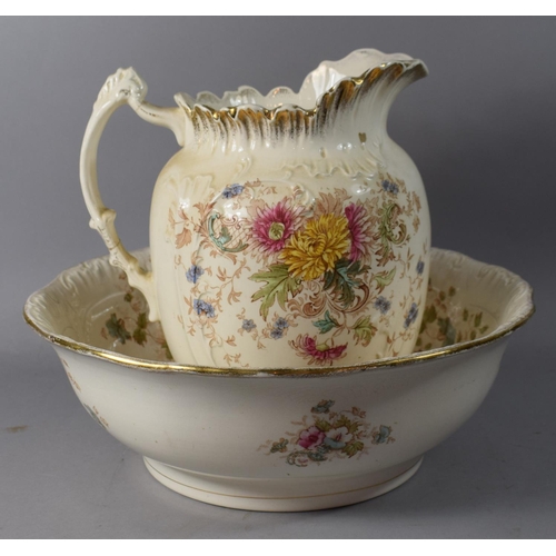 256 - An Edwardian Floral Pattern Toilet Jug and Bowl Set