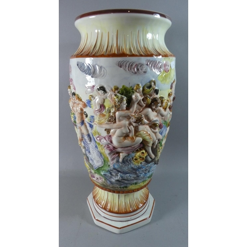 261 - A Large Naples Capodimonte Vase Decorated in Relief Bacchus Scene, 54cm high