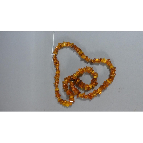 277 - A String of Amber Chip Beads, 41g