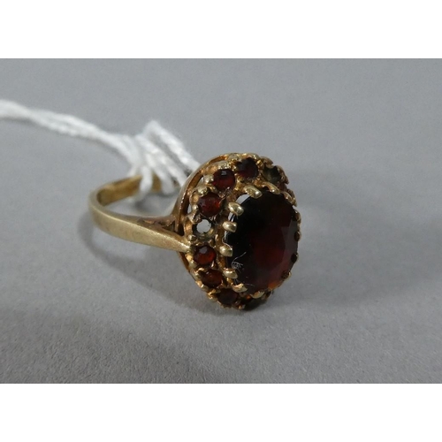 278 - A 9ct Gold Ladies Dress Ring Mounted with Garnet, Size O, 3.6g