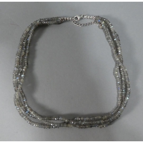 298 - A Silver and Moonstone Three Strand Necklace