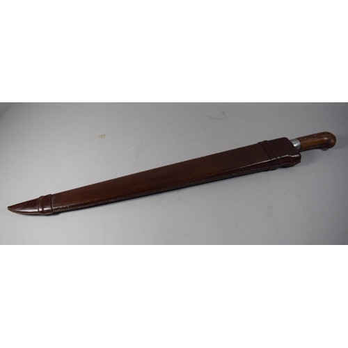 49 - A Vintage Wooden Handled Machete with Leather Scabbard, Blade 58.5cm Long