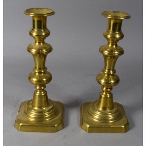 64 - A Pair of Brass Victorian Candlesticks with Pushers, 21cm High