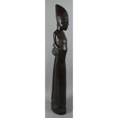 66 - A Large Carved Wooden African Tribal Figure of a Maiden, 64cm High